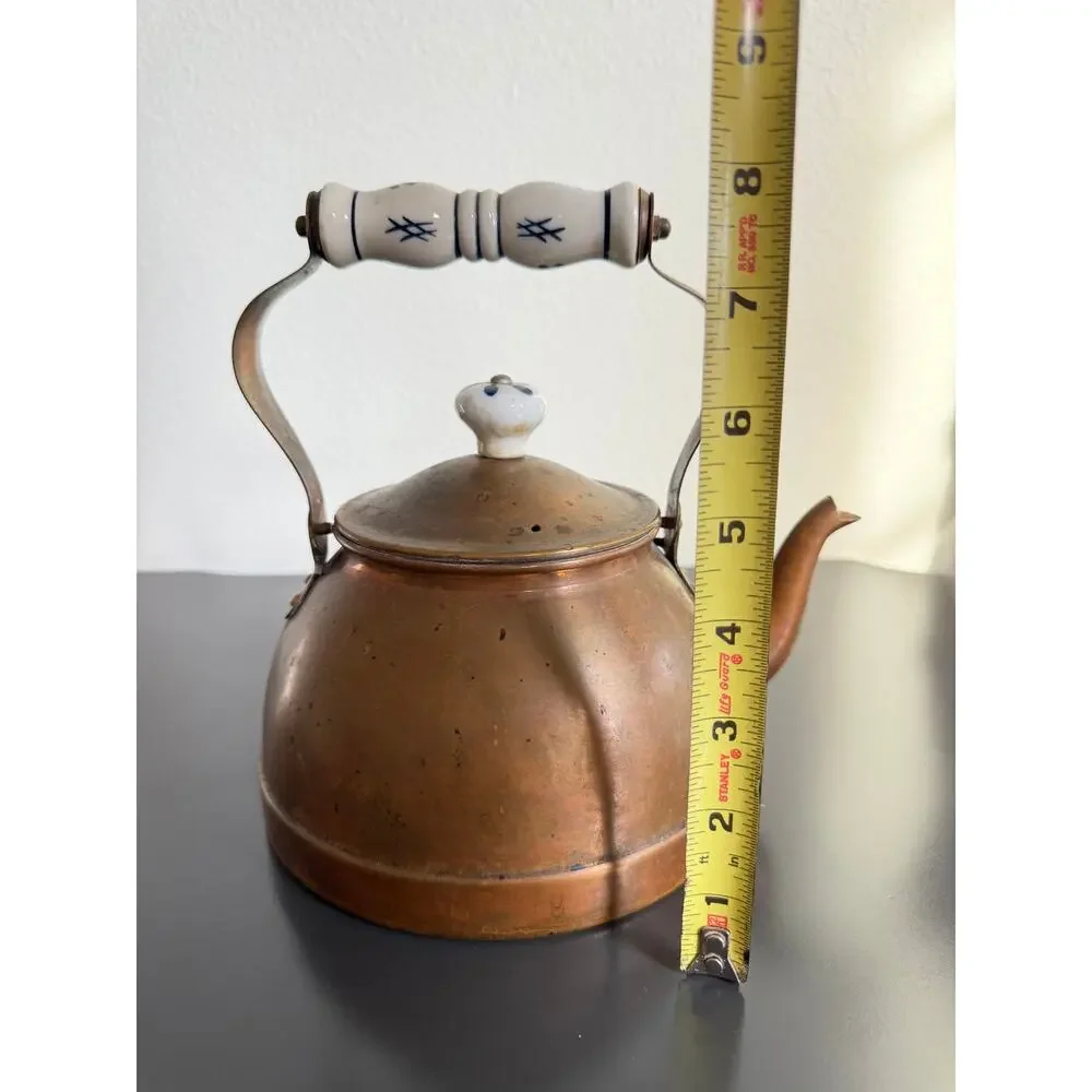 Vintage copper tea kettle with hand-painted blue and white porcelain handle lid